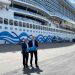 Havnedirektør Willy B. Hansen og CFO samt partner i PowerCon, Peter Castberg Knudsen, foran krydstogtskibet AIDAnova med det første af fire landstrømsstik, der skal forsyne krydstogtskibe med landstrøm. foto: Skagen Havn